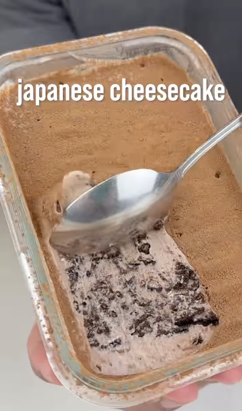 Japanese Chocolate Oreo Cheesecake in a glass container with a spoon